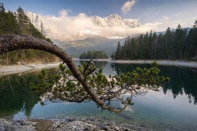 Scenic view of lake with mountain range in background