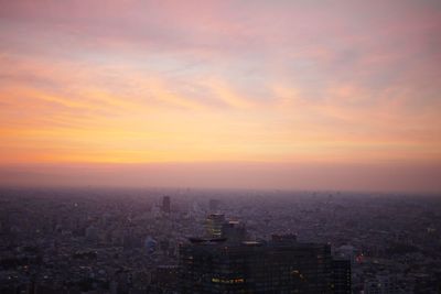 High angle view of buildings against sky during sunset