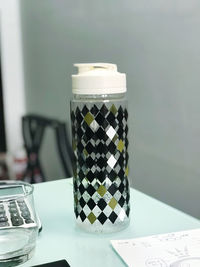 Close-up of glass of jar on table