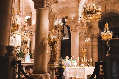 People in illuminated temple