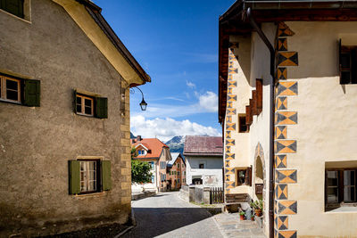 Houses in town against sky