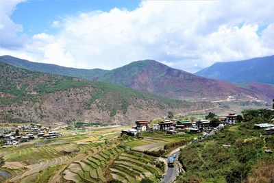 Scenic view of landscape and mountains against sky