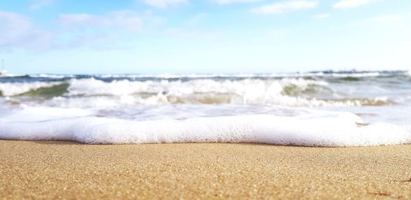 Surface level of beach against sky