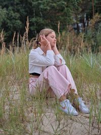 Beautiful girl in sitting near the jurmala beach