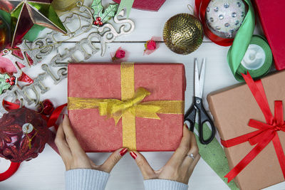 Close-up of woman holding red gift box