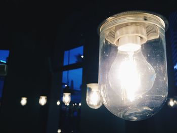 Low angle view of illuminated light bulb