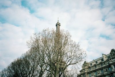 Low angle view of building against cloudy sky