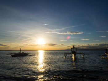 Scenic view of sea at sunset