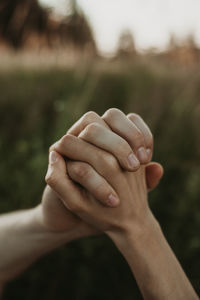 Cropped hand of woman holding hands