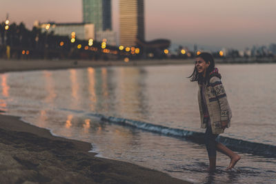 Portrait of woman standing in water