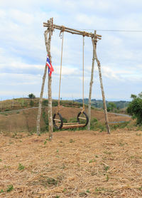 Built structure on field against sky