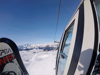 Panoramic view of snowcapped mountains against clear blue sky