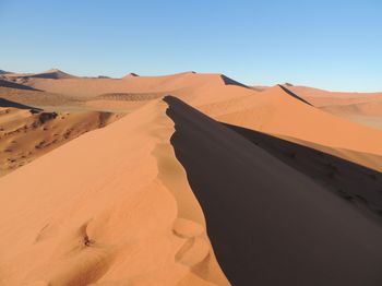 Scenic view of desert against clear sky