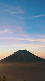 Scenic view of silhouette mountain against sky during sunset