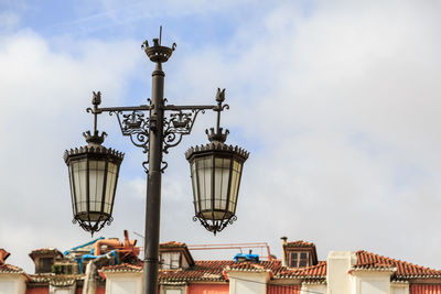 Low angle view of street light against sky