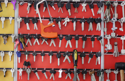 Close-up of keys hanging on hooks in workshop