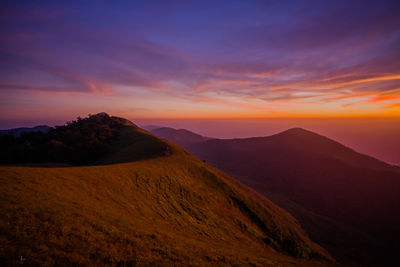 Scenic view of mountains against sky during sunset