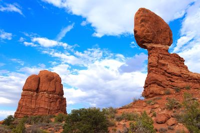 Low angle view of rock formation against sky