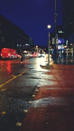 Cars on road in city at night