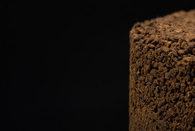 Close-up of bread against black background