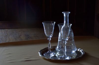 Close-up of wine glasses on table