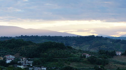 High angle view of houses and trees against sky