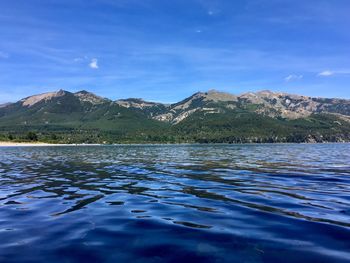 Scenic view of lake against blue sky