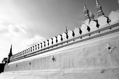 Low angle view of temple on building against sky