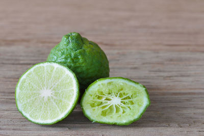 Close-up of green fruits on table