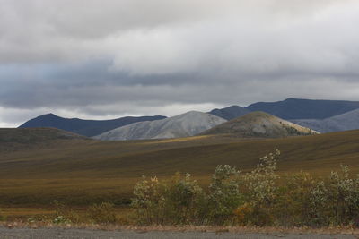 Scenic view of landscape and mountains against sky