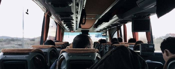 Rear view of people sitting in bus
