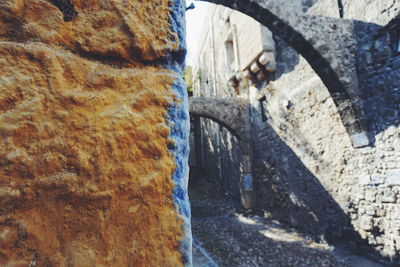 Close-up of rock formation against sky