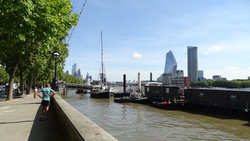 View of boats moored in river