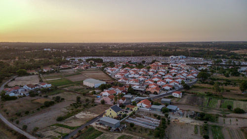 High angle view of townscape against sky during sunset