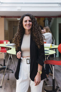 Portrait of a smiling brunette businesswoman in office