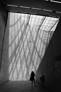 Full length of woman standing in building