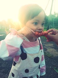 Portrait of cute girl holding ice cream