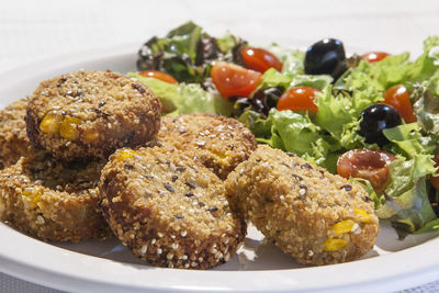 Close-up of vegan nuggets and salad