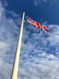 Low angle view of flag against sky