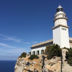 Lighthouse against blue sea