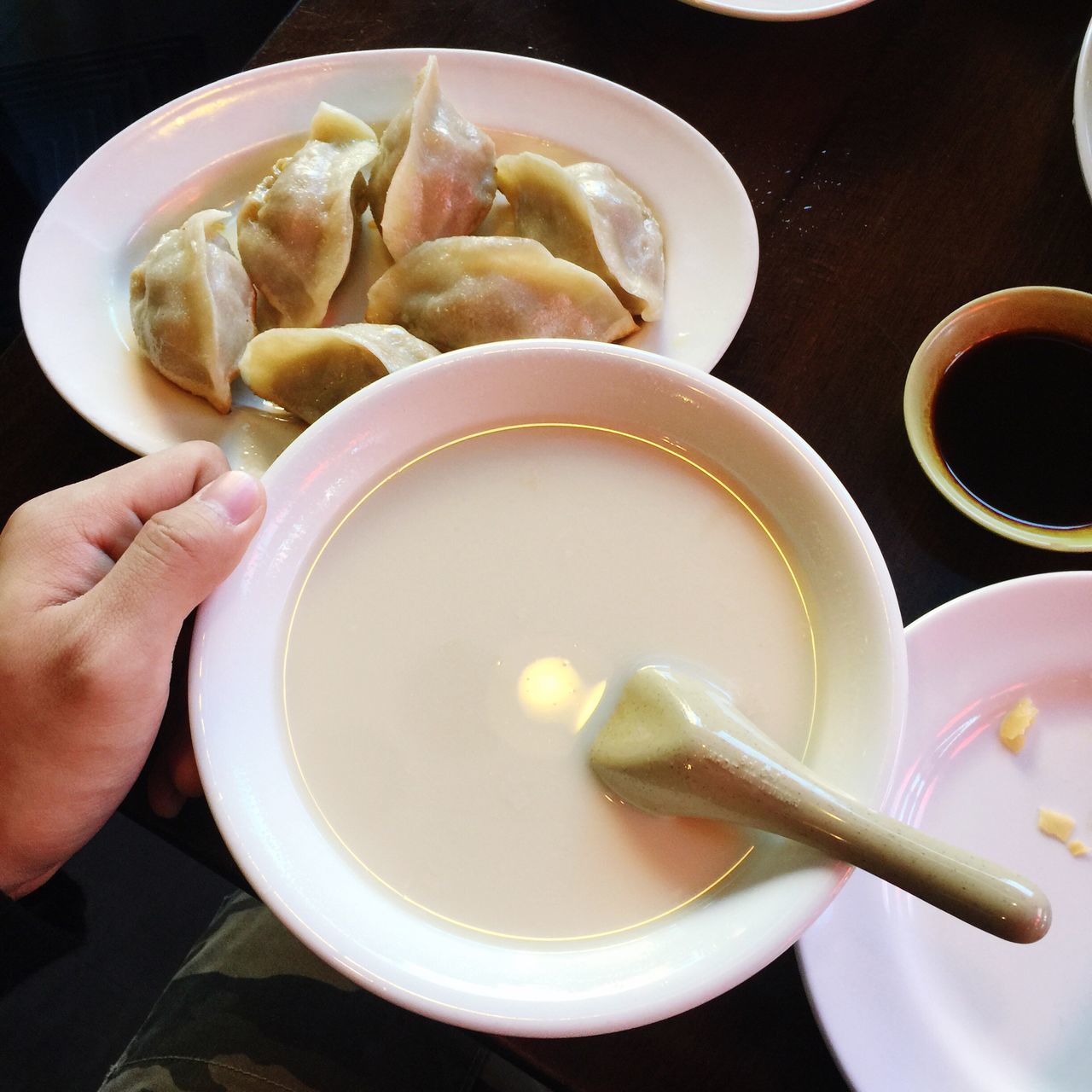 food and drink, human hand, holding, food, real people, human body part, freshness, one person, bowl, indoors, dumpling, healthy eating, plate, lifestyles, ready-to-eat, close-up, day, people