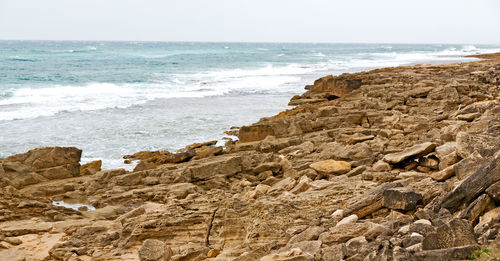 Scenic view of beach against sky