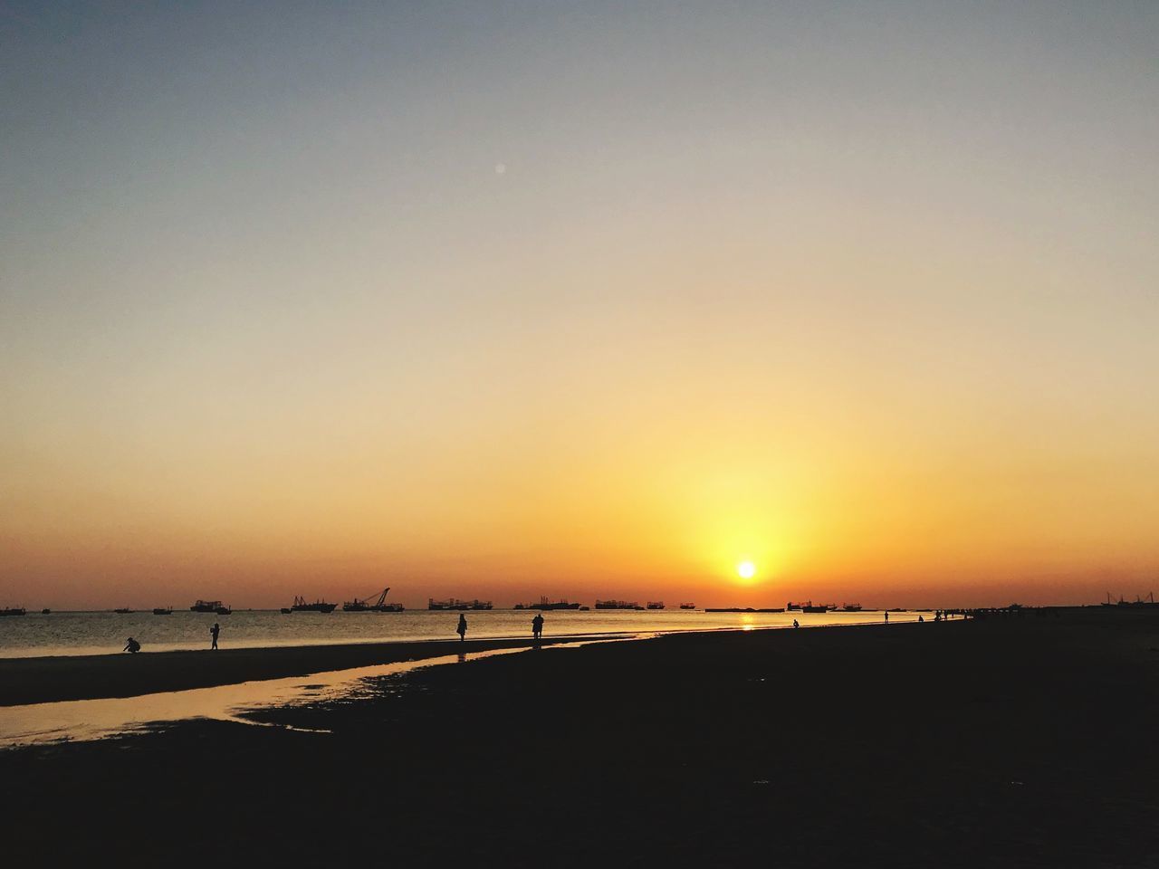 SCENIC VIEW OF SUNSET OVER SEA