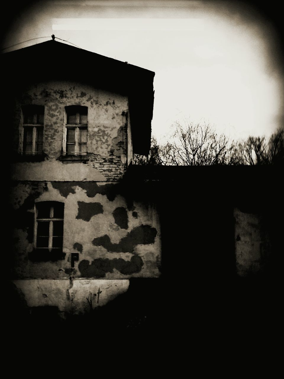 architecture, built structure, building exterior, window, abandoned, sky, wall - building feature, old, brick wall, house, low angle view, weathered, stone wall, obsolete, damaged, wall, no people, day, outdoors, run-down