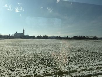 Scenic view of agricultural field against sky