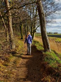 Rear view of man walking on land