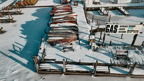 Above view of frozen lake resort. canoes and docks. 