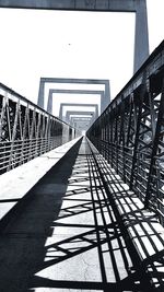 View of footbridge against clear sky