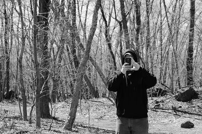 Man standing in forest