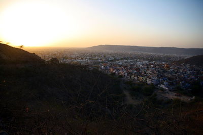 High angle view of city during sunset